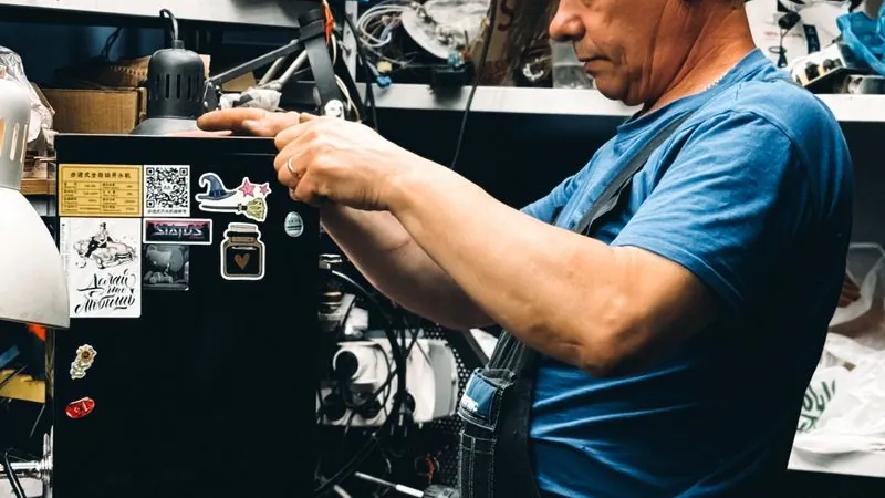 Technician repairing equipment in a workshop